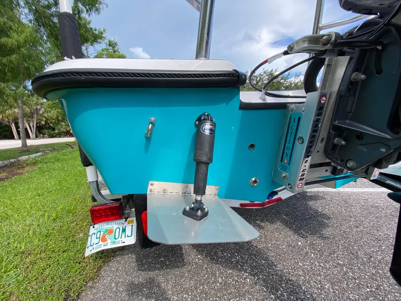 Slide: The Image of 2023 Action Craft 1720 Flats Gen 3 boat, rear view with trim tab and motor. - 21