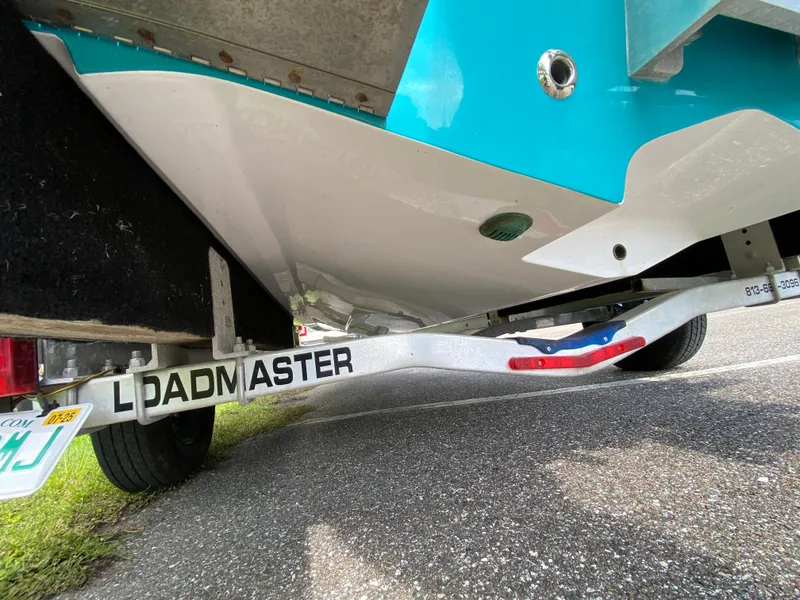 Slide: The Image of 2023 Action Craft 1720 Flats Gen 3 boat on Loadmaster trailer, close-up view. - 22