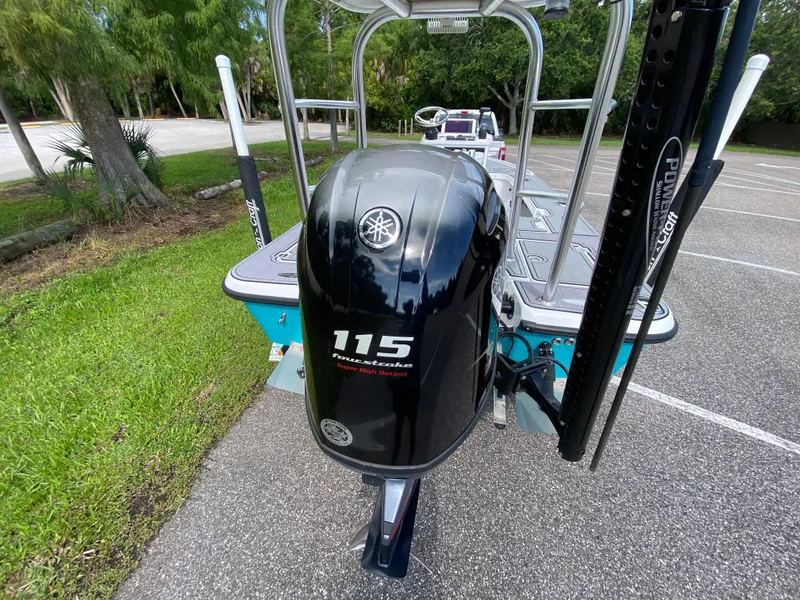 Slide: The Image of 2023 Action Craft 1720 Flats Gen 3 boat with Yamaha 115 outboard motor in parking lot. - 26