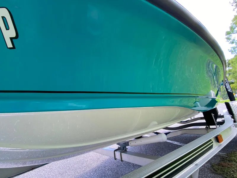 Slide: The Image of 2023 Action Craft 1720 Flats Gen 3 boat on trailer, vibrant teal hull. - 28