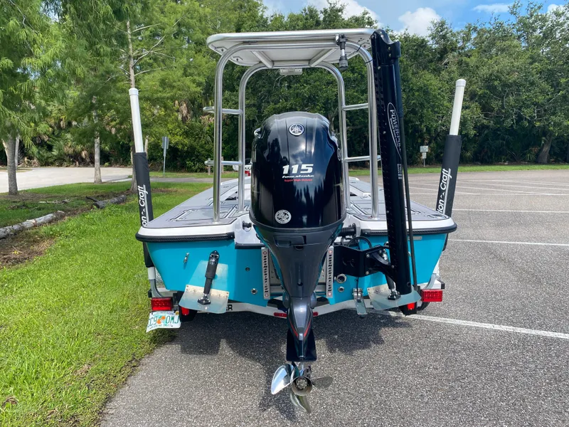 Slide: The Image of 2023 Action Craft 1720 Flats Gen 3 boat with Yamaha 115 engine, parked outdoors. - 3