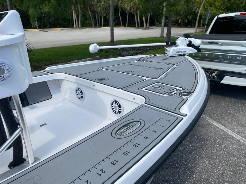 Slide: The Image of 2023 Action Craft 1720 Flats Gen 3 boat with Minn Kota trolling motor in parking lot. - 31