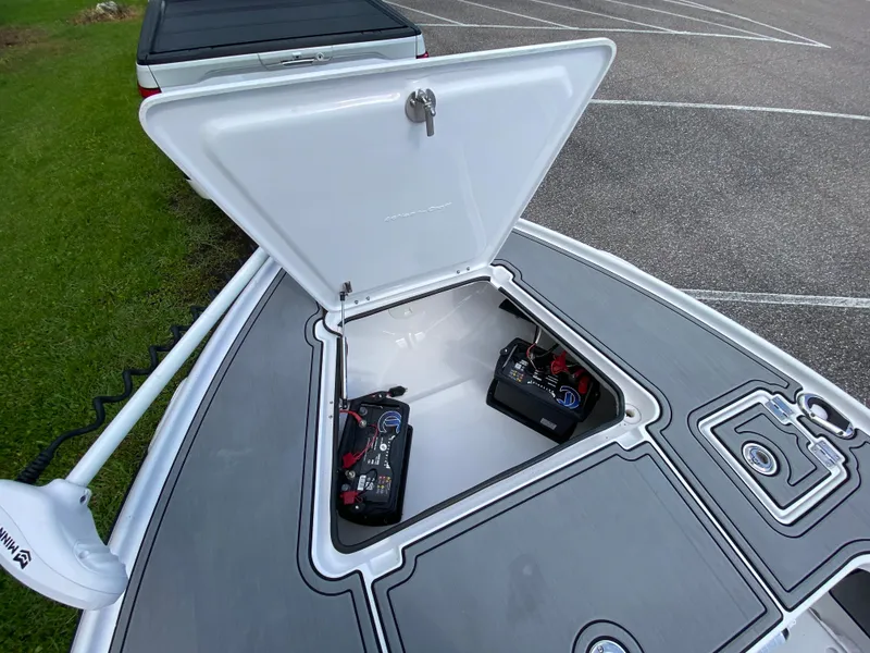 Slide: The Image of 2023 Action Craft 1720 Flats Gen 3 boat with open storage compartment and batteries. - 34