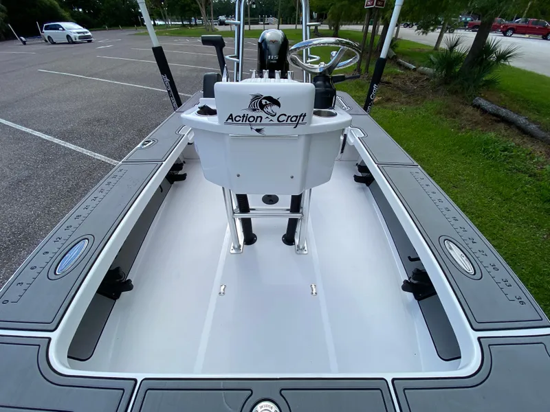 Slide: The Image of 2023 Action Craft 1720 Flats Gen 3 boat interior with steering console in parking lot. - 43