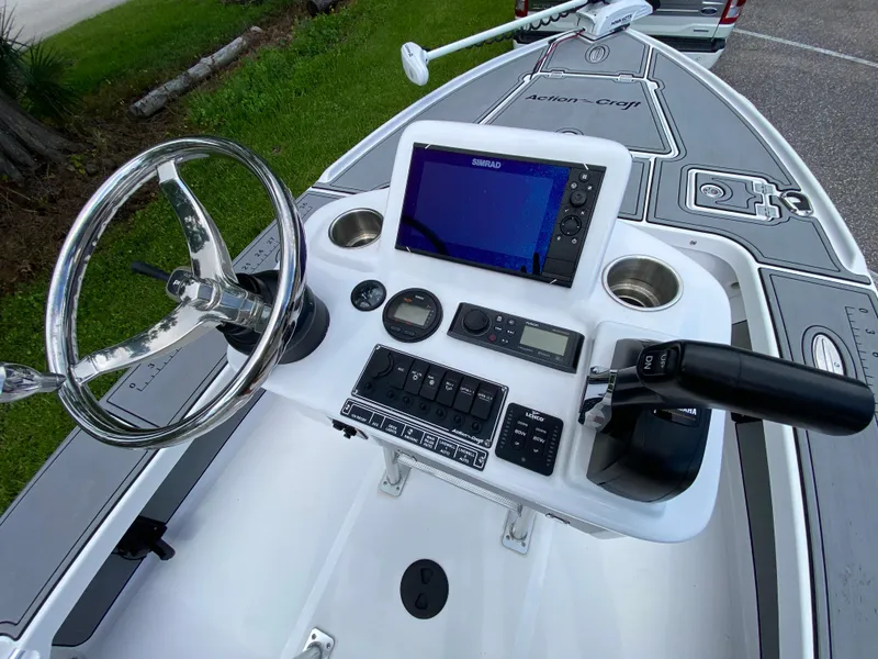 Slide: The Image of 2023 Action Craft 1720 Flats Gen 3 boat console with steering wheel and navigation system. - 46