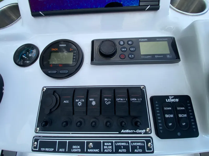 Slide: The Image of 2023 Action Craft 1720 Flats Gen 3 dashboard with controls and gauges. - 48