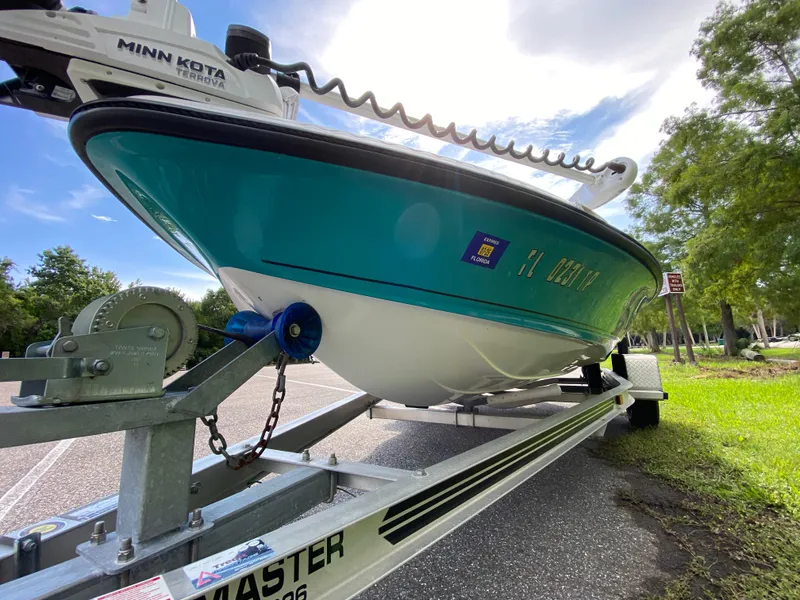 Slide: The Image of 2023 Action Craft 1720 Flats Gen 3 boat on trailer, featuring Minn Kota Terrova motor. - 7