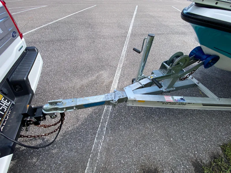 Slide: The Image of Trailer hitch connecting Action Craft 1720 Flats Gen 3 boat to vehicle in parking lot. - 8