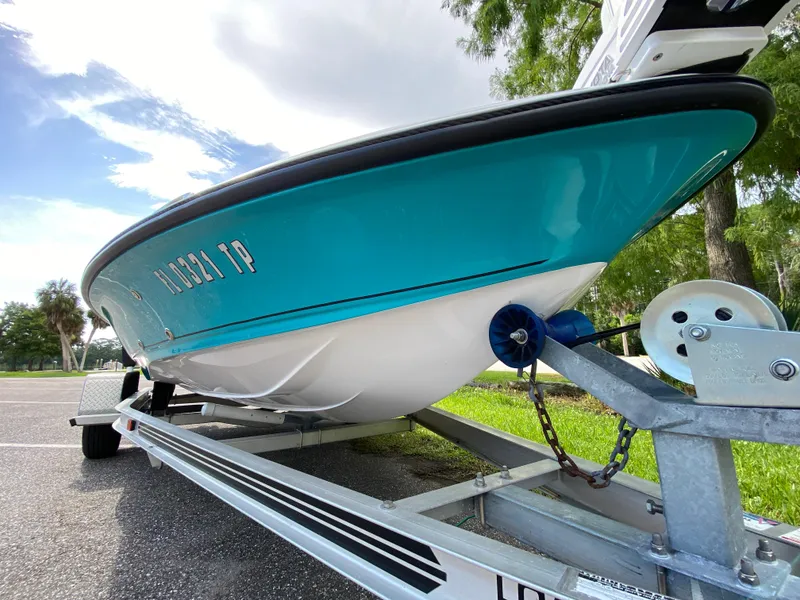 Slide: The Image of 2023 Action Craft 1720 Flats Gen 3 boat on trailer, vibrant blue hull. - 9