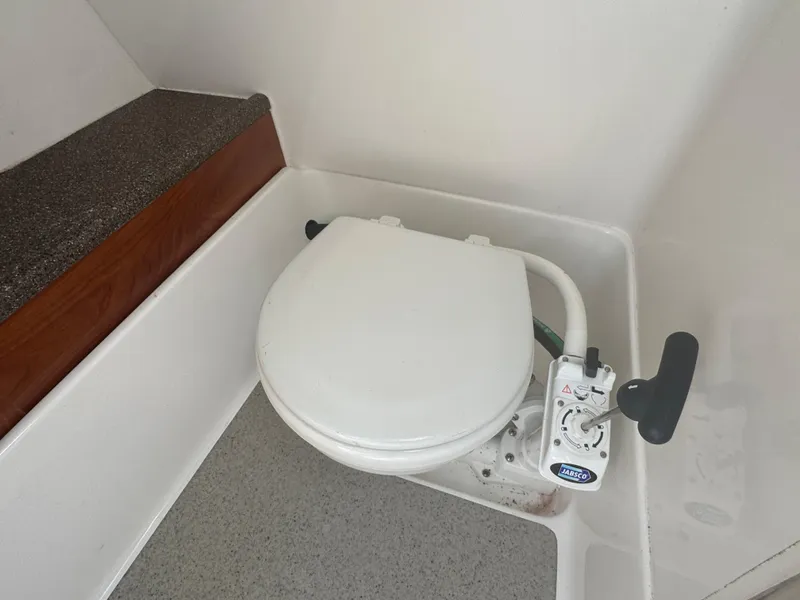 Slide: The Image of Marine toilet in 2013 Rinker 296 Captiva Bowrider boat interior. - 12