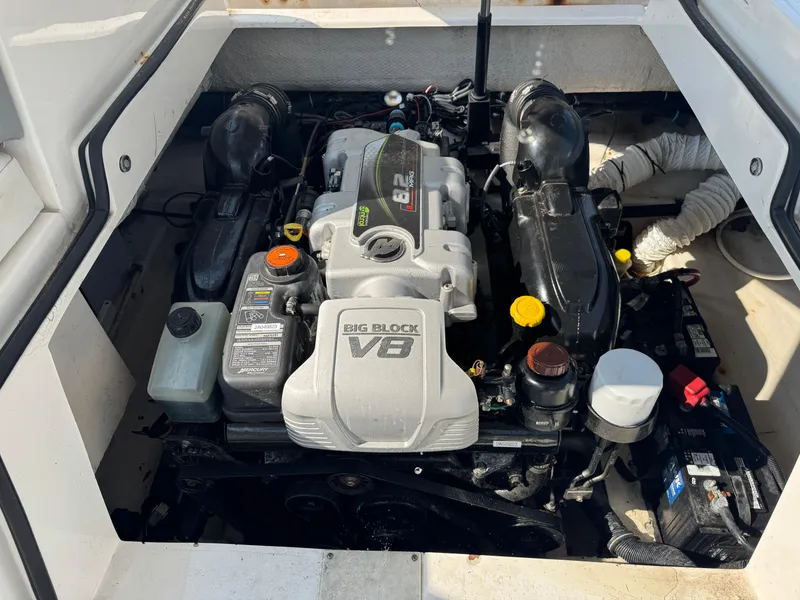 Slide: The Image of 2013 Rinker 296 Captiva Bowrider engine compartment with Big Block V8 engine. - 20