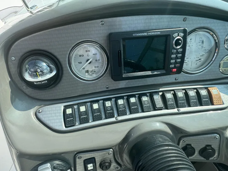 Slide: The Image of Dashboard of a 2013 Rinker 296 Captiva Bowrider with gauges and controls. - 8