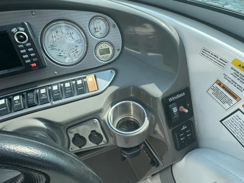 Slide: The Image of Control panel of a 2013 Rinker 296 Captiva Bowrider boat with gauges and switches. - 9