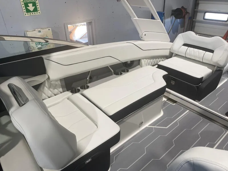 Slide: The Image of 2024 Regal LX4 boat interior with luxurious white seating and modern design. - 6