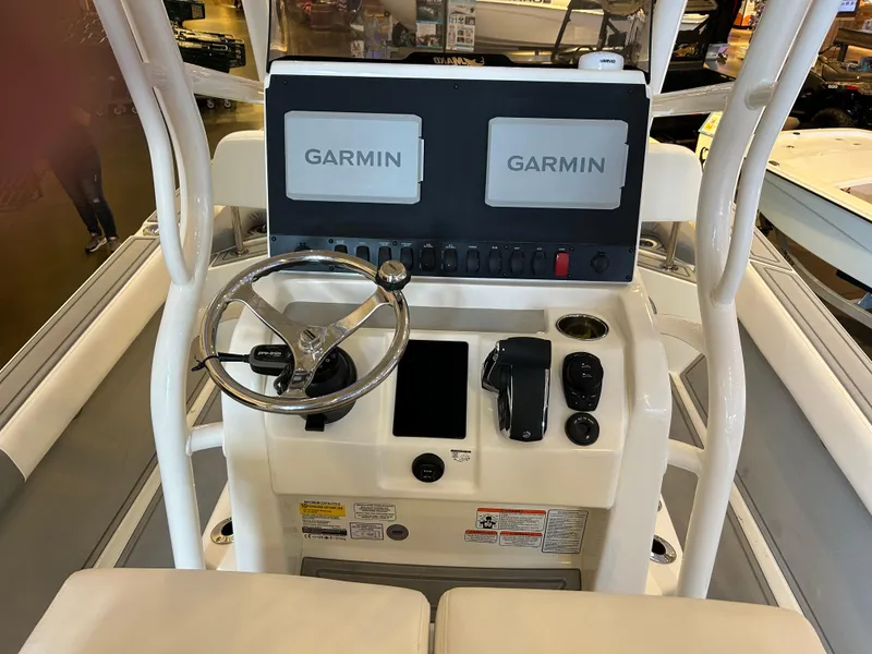 Slide: The Image of Control console of 2025 Mako 24 APEX boat with dual Garmin displays. - 2