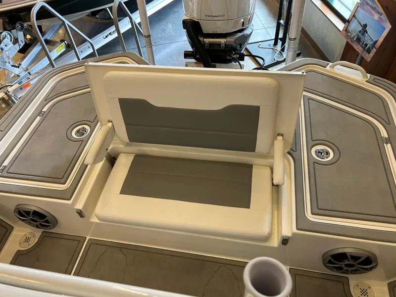 Slide: The Image of 2025 Mako 24 APEX boat interior with foldable seating and storage compartments. - 3