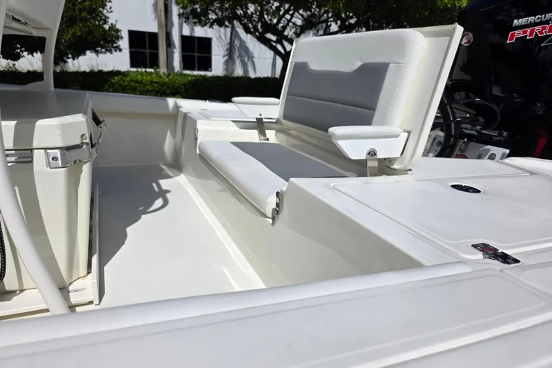 Slide: The Image of 2025 Mako 24 APEX boat interior with seating and storage compartments. - 15