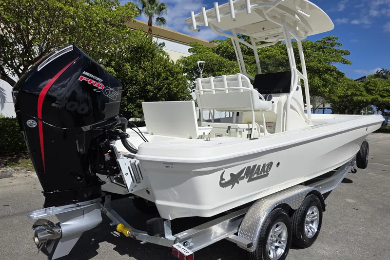 Slide: The Image of 2025 Mako 24 APEX boat with Mercury Pro XS engine on a trailer. - 20