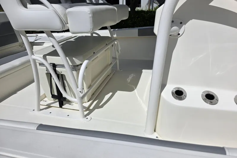 Slide: The Image of Interior of 2025 Mako 24 APEX boat featuring seating and storage area. - 3