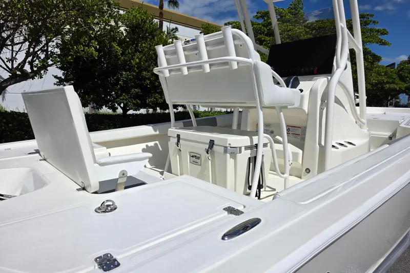 Slide: The Image of 2025 Mako 24 APEX boat interior with seating and console, showcasing modern design. - 5