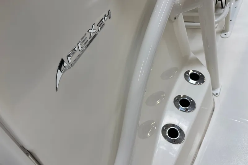 Slide: The Image of Close-up of 2025 Mako 24 APEX boat detailing with chrome accents. - 35