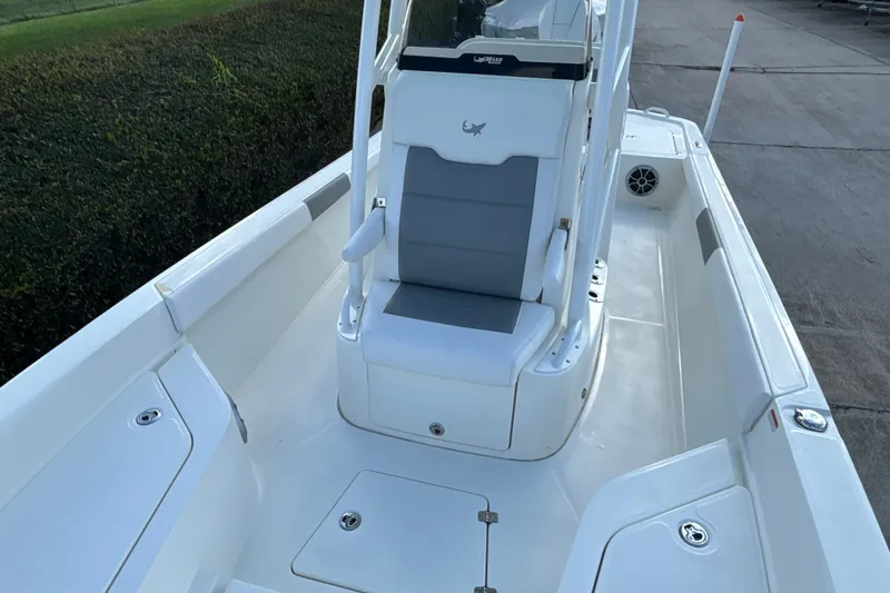 Slide: The Image of 2025 Mako 24 APEX boat interior with seating and storage compartments. - 18