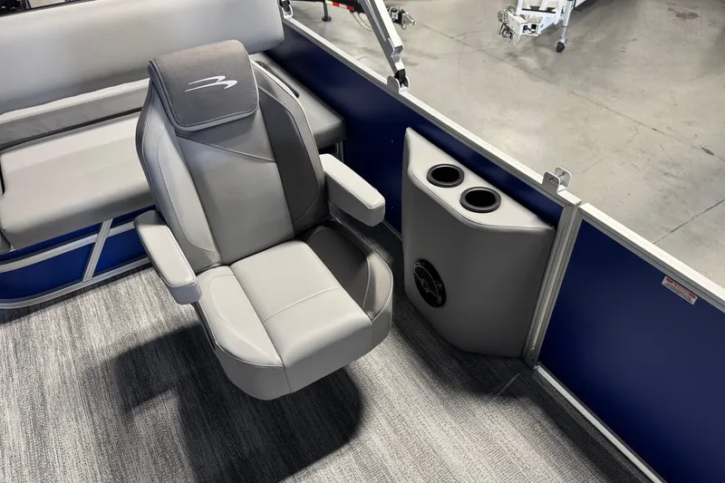 Slide: The Image of 2026 Bennington 21 SSB boat interior with gray seating and cup holders. - 10