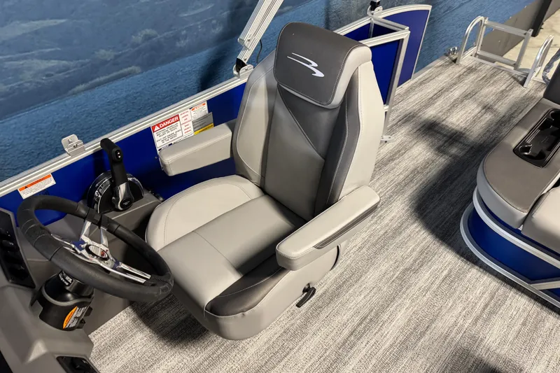 Slide: The Image of Captain's seat of 2026 Bennington 21 SSB pontoon boat with steering wheel and controls. - 11