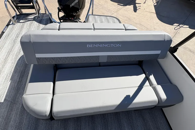 Slide: The Image of 2026 Bennington 22 MSB boat with gray seating and visible motor. - 10