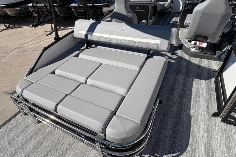 Slide: The Image of 2026 Bennington 22 MSB boat interior with gray cushioned seating and modern design. - 11
