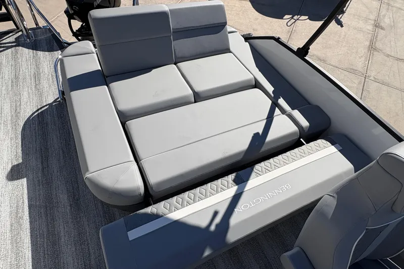 Slide: The Image of 2026 Bennington 22 MSB boat interior with gray cushioned seating. - 12