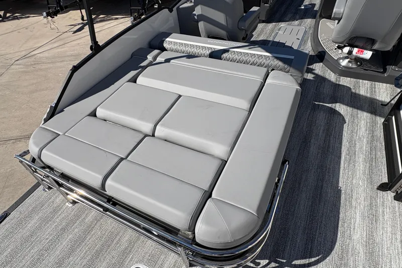 Slide: The Image of 2026 Bennington 22 MSB boat with gray cushioned seating and sleek design. - 13