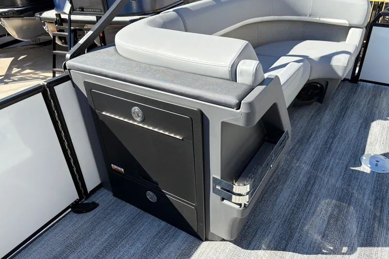 Slide: The Image of 2026 Bennington 22 MSB boat interior with gray seating and storage compartment. - 17