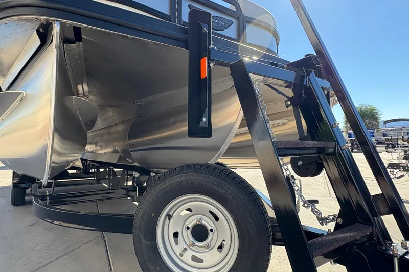 Slide: The Image of 2026 Bennington 22 MSB pontoon boat on trailer, close-up view. - 21