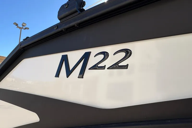 Slide: The Image of 2026 Bennington 22 MSB boat with "M22" emblem on the side. - 23