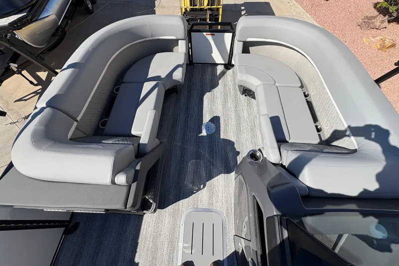 Slide: The Image of 2026 Bennington 22 MSB pontoon boat interior with gray seating and carpeted flooring. - 6