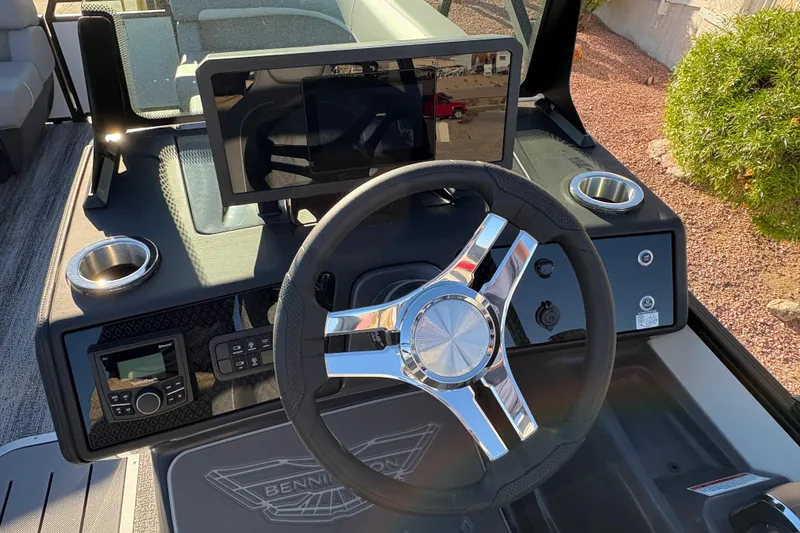 Slide: The Image of Steering console of 2026 Bennington 22 MFB boat with modern controls and touchscreen display. - 11