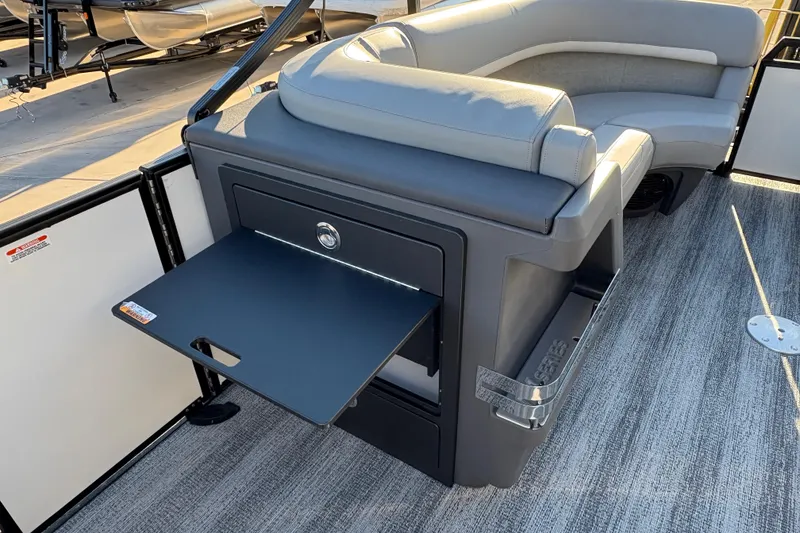 Slide: The Image of 2026 Bennington 22 MFB boat interior with seating and fold-out table. - 12