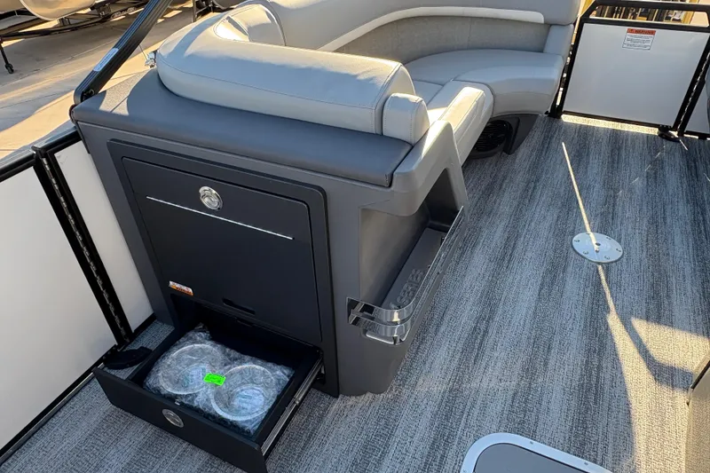 Slide: The Image of 2026 Bennington 22 MFB boat interior with seating and storage drawer. - 13