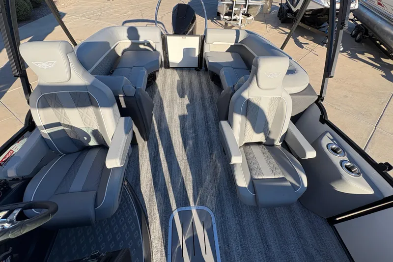 Slide: The Image of 2026 Bennington 22 MFB boat interior with luxurious gray seating and modern design. - 7