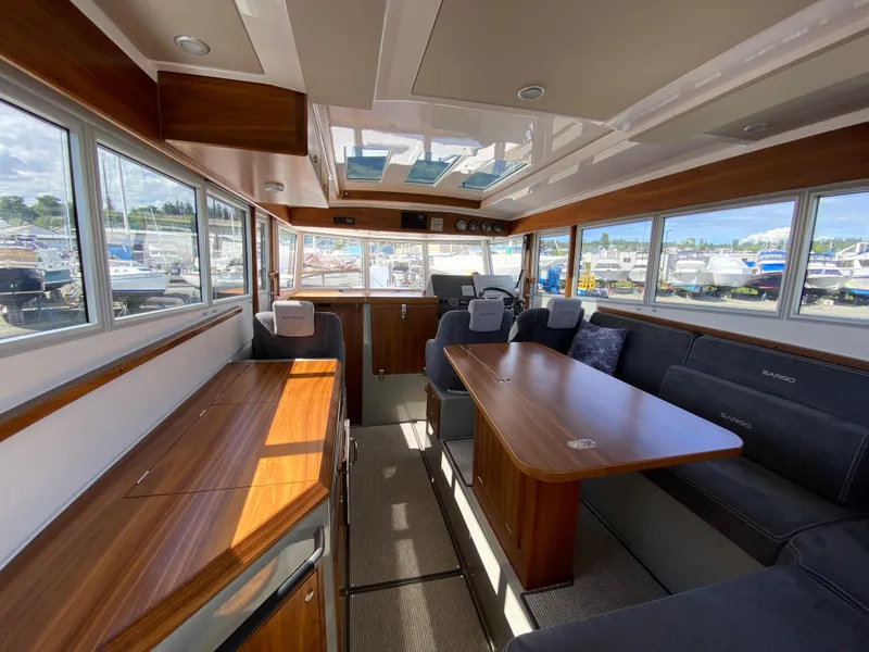 Slide: The Image of Interior of 2019 Sargo 36 Explorer boat with wooden finishes and spacious seating area. - 12