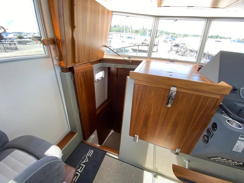 Slide: The Image of Interior of 2019 Sargo 36 Explorer boat with wooden cabinetry and seating. - 18