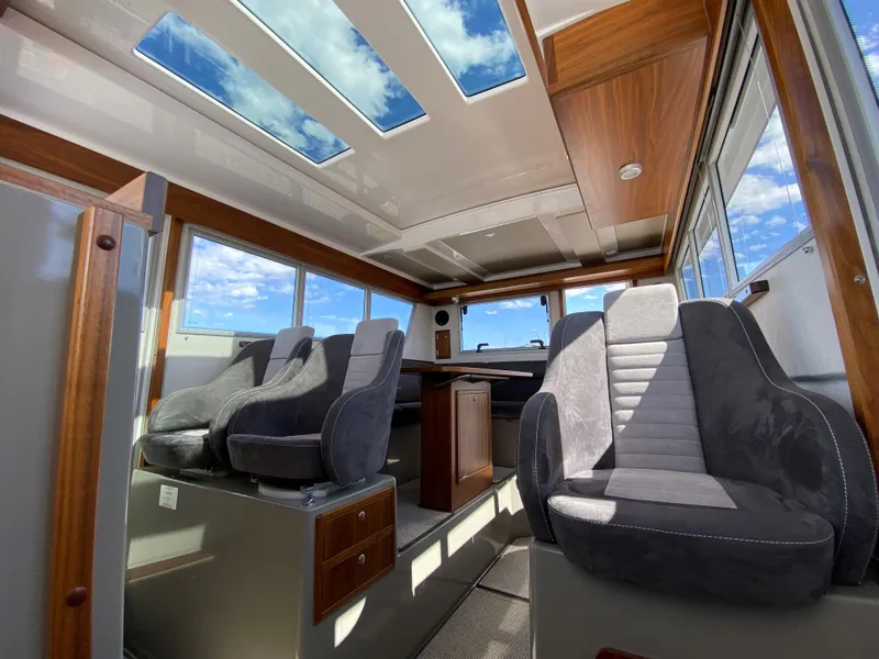 Slide: The Image of Interior of 2019 Sargo 36 Explorer boat with skylights and plush seating. - 25