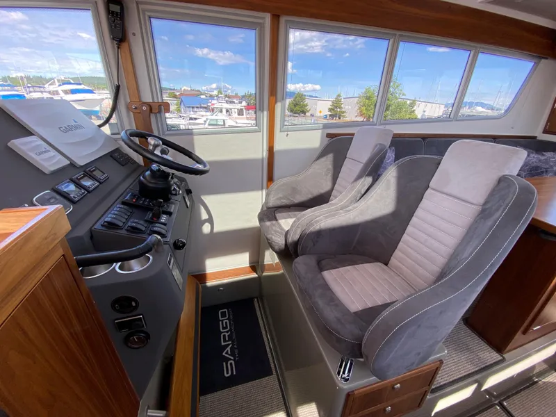 Slide: The Image of Interior of 2019 Sargo 36 Explorer boat with steering wheel and two seats. - 26