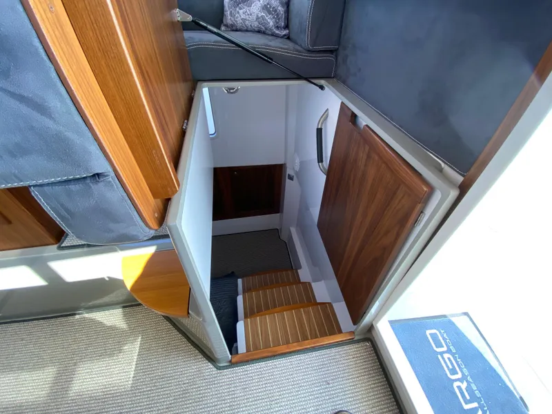 Slide: The Image of Interior view of 2019 Sargo 36 Explorer, showcasing wooden stairs and cabin entrance. - 29