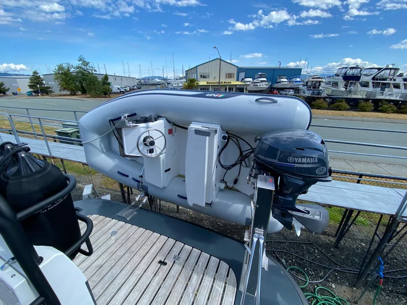 Slide: The Image of 2019 Sargo 36 Explorer with Yamaha motor, docked under a clear blue sky. - 6