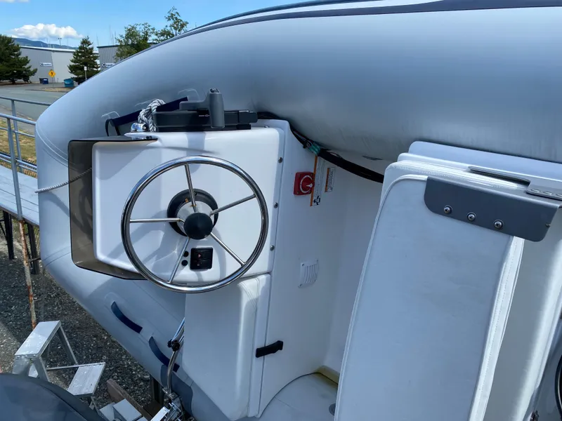 Slide: The Image of 2019 Sargo 36 Explorer boat helm with steering wheel and controls. - 7