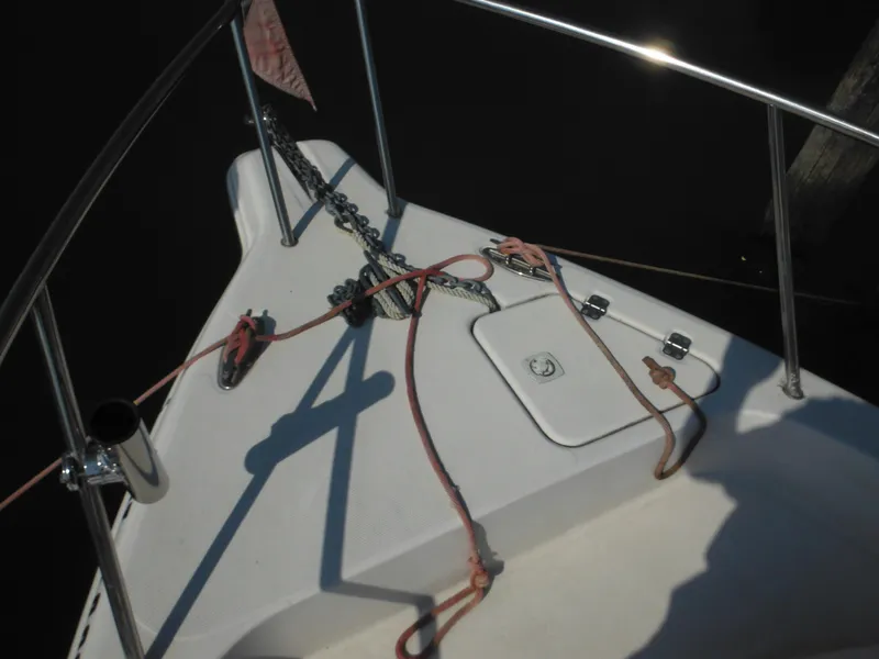 Slide: The Image of Bow of 2002 Pro-Line 23 Walk boat with anchor and ropes. - 12