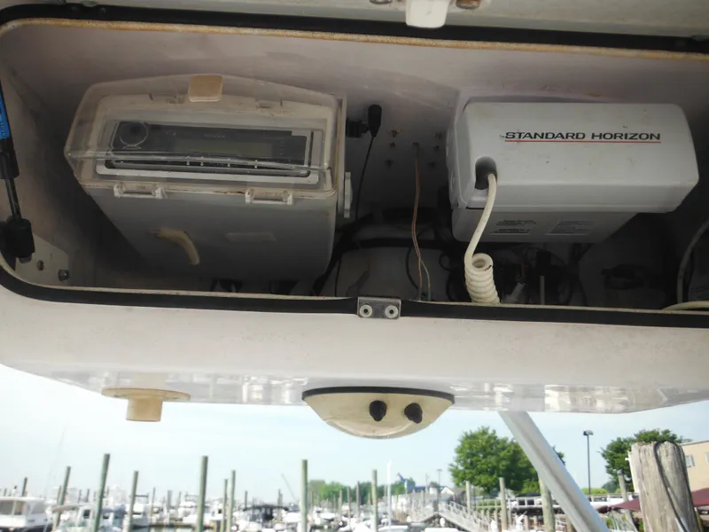 Slide: The Image of 2002 Pro-Line 23 Walk boat electronics compartment with Standard Horizon equipment. - 26