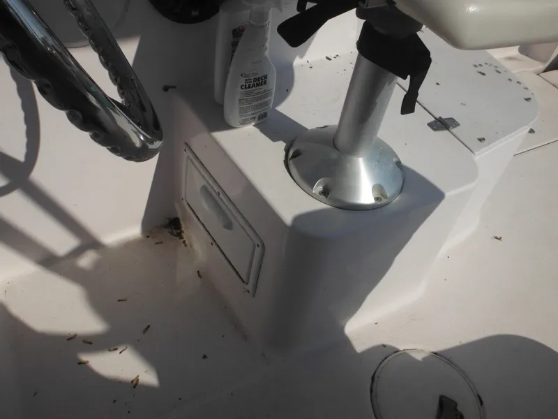 Slide: The Image of 2002 Pro-Line 23 Walk boat interior with steering wheel and deck cleaner. - 27